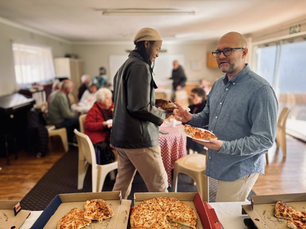 Benoni Baptist Church Pizza with the pastor